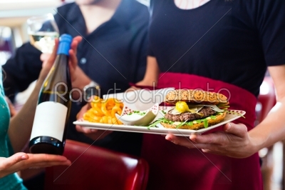 People in American diner or restaurant with wine