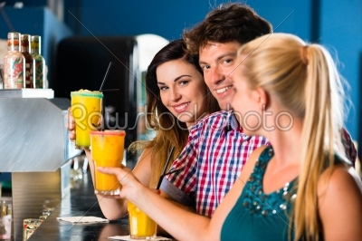 People in club or bar drinking