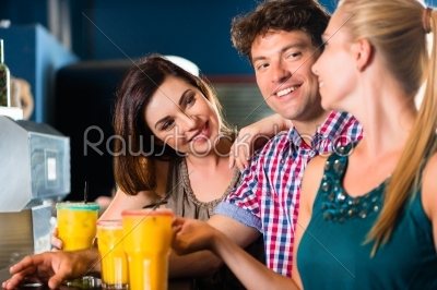 People in club or bar drinking