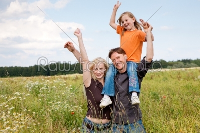 Piggyback family outdoors
