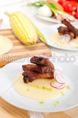 pork ribs on polenta corn cream bed