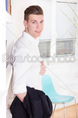 portrait of a stylish fashionable young man in white shirt