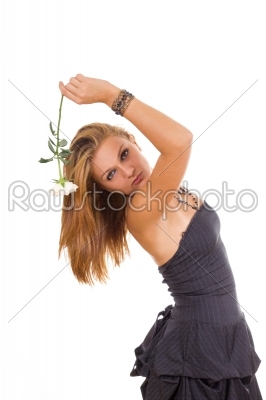 portrait of beautiful woman in dress posing with rose