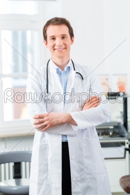 Portrait of young doctor in clinic