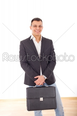 positive businessman in suit with briefcase