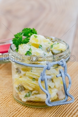 Potato salad in a jar on wooden