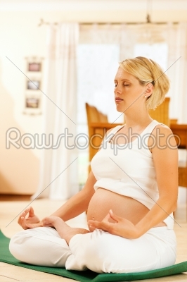 Pregnant woman doing pregnancy yoga