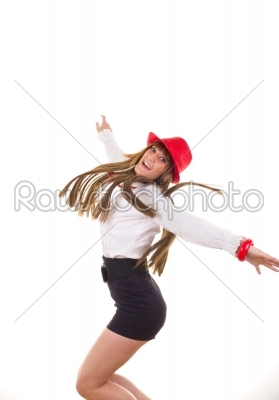 pretty smiling girl with the red hat jumping