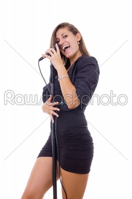 pretty woman singer holding a microphone singing