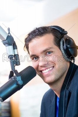 Radio presenter in radio station on air