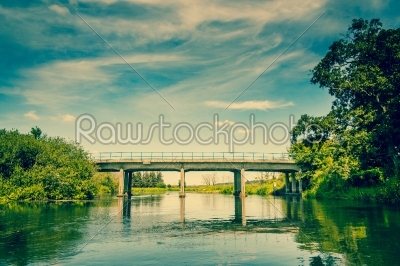 River landscape with a small bridge