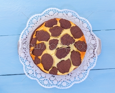 Russian chocolate cheesecake on a blue wooden background