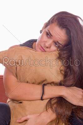 sad girl hugging pillow