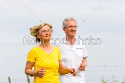 Seniors jogging in the nature doing sport