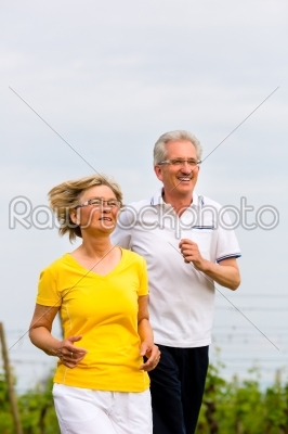 Seniors jogging in the nature doing sport