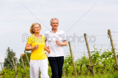 Seniors running in the nature doing sport