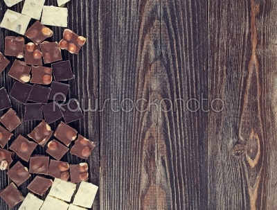 set of chocolates  on dark wooden table