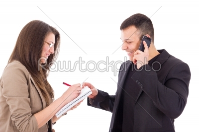 smiling director on the phone and his secretary writing down not