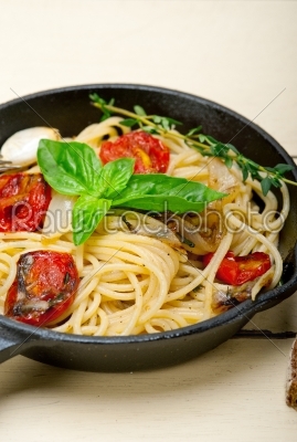 spaghetti pasta with baked cherry tomatoes and basil 