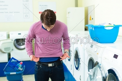 Student in a laundry with shrunk pullover