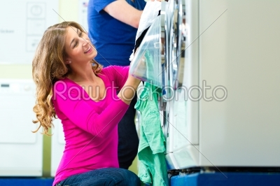 Students in a coin laundry washing 