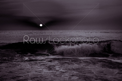Sunrise sunset over the sea ocean waves in black and white