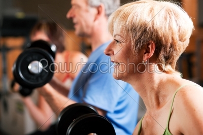Three senior people in gym