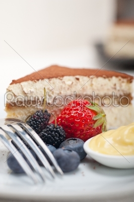 tiramisu dessert with berries and cream