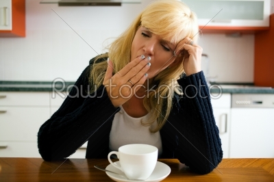 Tired woman yawning