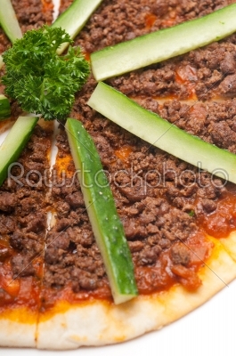 Turkish beef pizza with cucumber on top