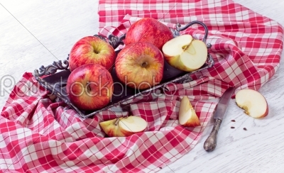 Vintage tray with apples onwhite wooden background