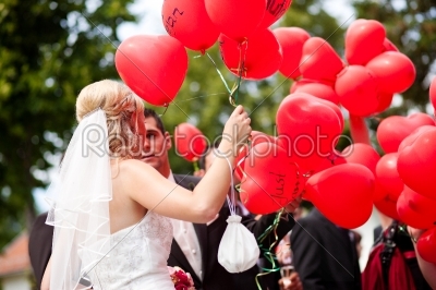 Wedding couple with balloons
