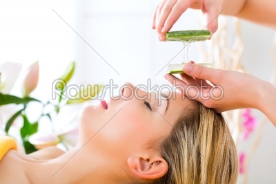 Wellness - woman having aloe vera application