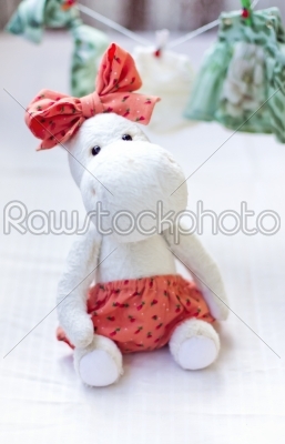 White hippo toy with textile and sewing accessory