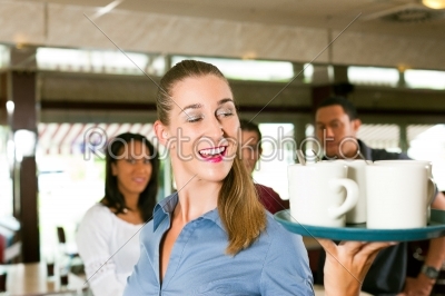 Woman as waitress in a bar or restaurant