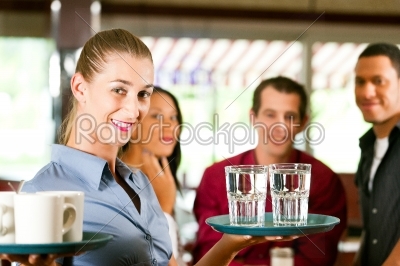 Woman as waitress in a bar or restaurant