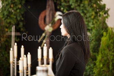 woman at funeral mourning