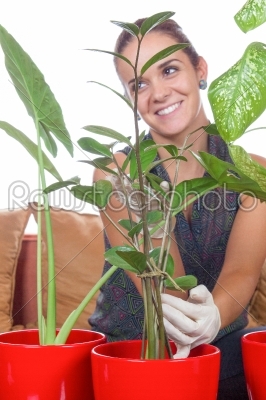 Woman cultivating flowers and laughing