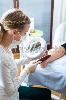 Woman in poidatry studio receiving pedicure