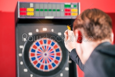 Woman playing darts