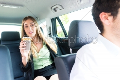 Woman traveling in taxi, she has an appointment