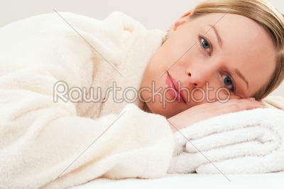 Woman with bath robe in spa