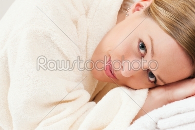 Woman with bath robe in spa