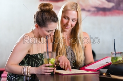 women or colleagues in cafe, bar or restaurant