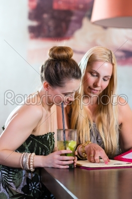 women or colleagues in cafe, bar or restaurant