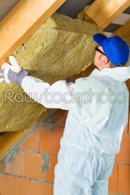 Worker setting thermal insulating material
