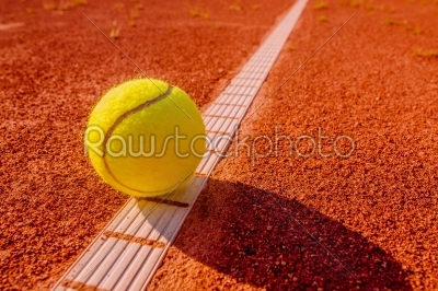 Yellow tennisball on the line