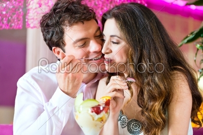 Young couple enjoying their time in ice cream parlor