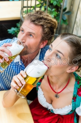 Young couple in Bavaria in restaurant or pub