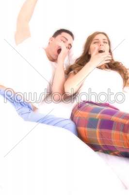 Young couple waking up in the bedroom 